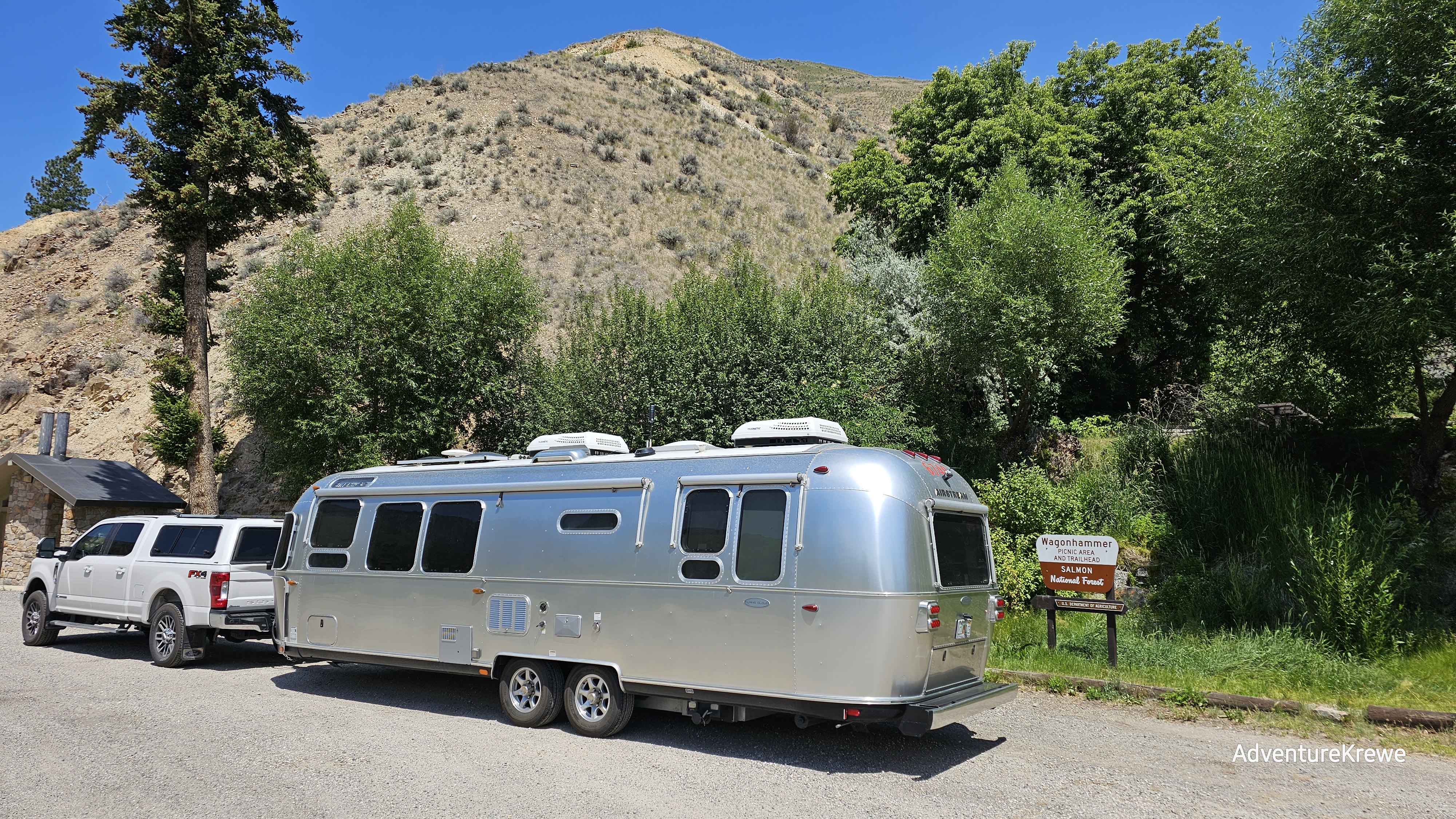 Airstream rig with saw tooth mtns in the background
