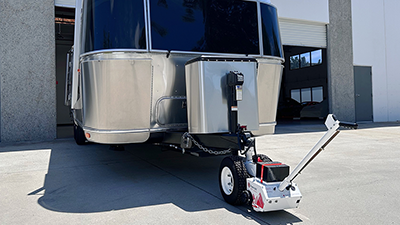 Airstream trailer being maneuvered by a Parkit360 trailer dolly