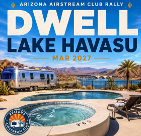 Image of an airstream near a lake and pool
